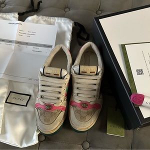 Gucci Women's Screener leather sneaker with pink accents.